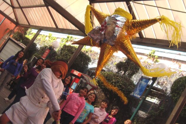 Children assaulting a piñata