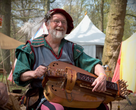 The Hurdy-Gurdy A musician playing the hurdy-gurdy