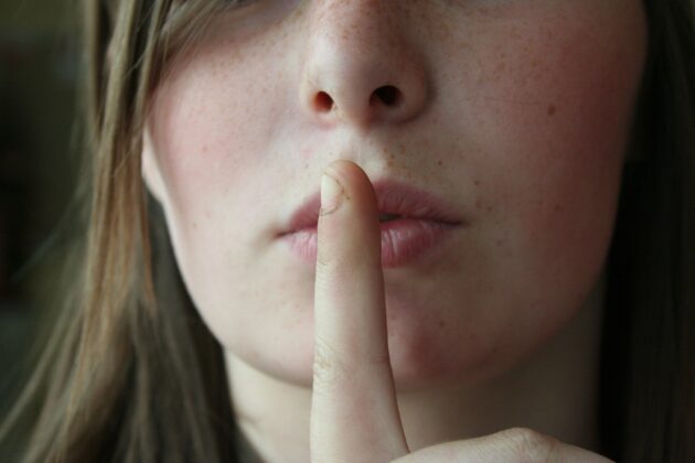 The Right-to-Quiet Movement Woman making the "shhhh" gesture