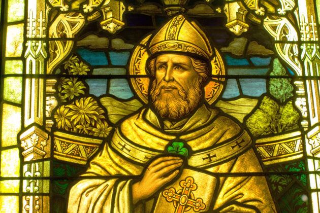 Detail of St Patrick with a shamrock in a stained glass window at the Smith Museum of Stained Glass Windows at Navy Pier in Chicago