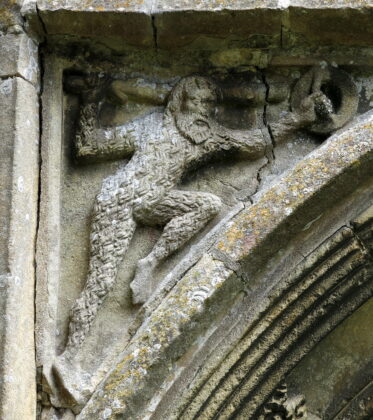 The Woodwose Wild Man (also Wildman, Woodwose, Wodewose), spandrel of the west doorway, the Church of St Mary, Cratfield, Suffolk, England